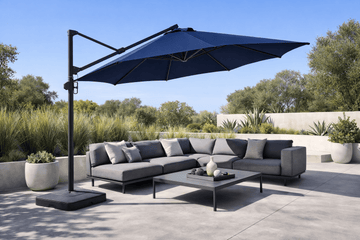 Modern outdoor sectional sofa with large cantilever patio umbrella on a contemporary patio